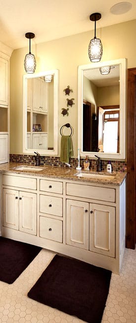 Combining Cabinet Finishes 1 bathroom with white kitchen cabinets and a sinks