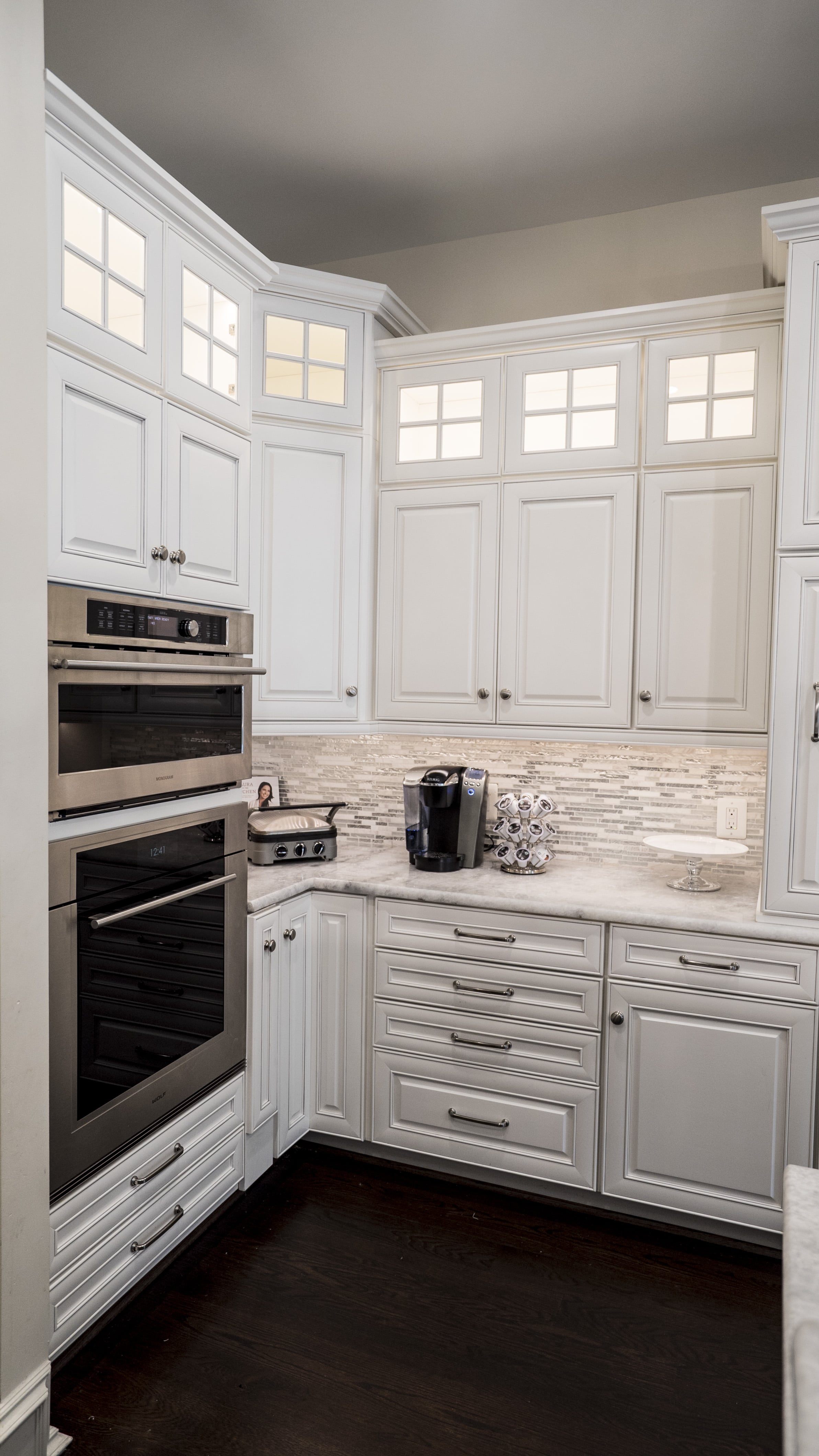 kitchen with white cabinets and a oven
