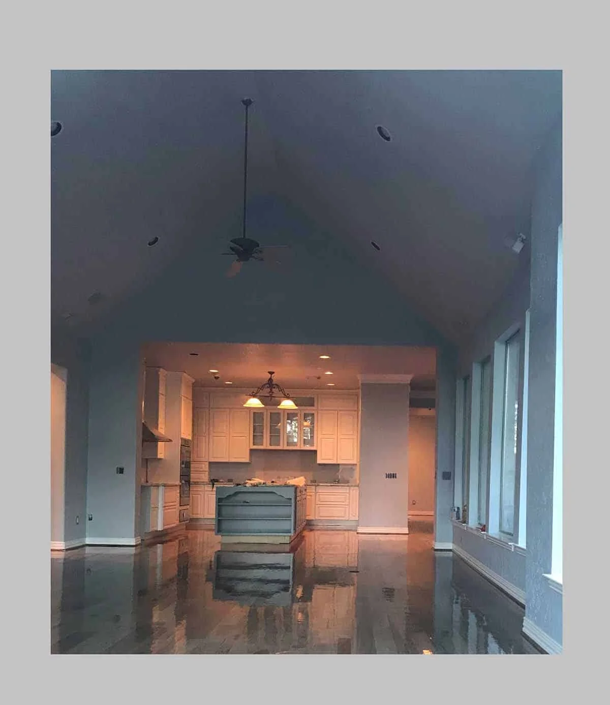 Wide view of the Kingwood kitchen remodel in Houston showing white Showplace cabinetry in an open-concept layout