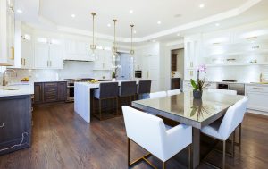 A kitchen with a wooden dining table and four chairs