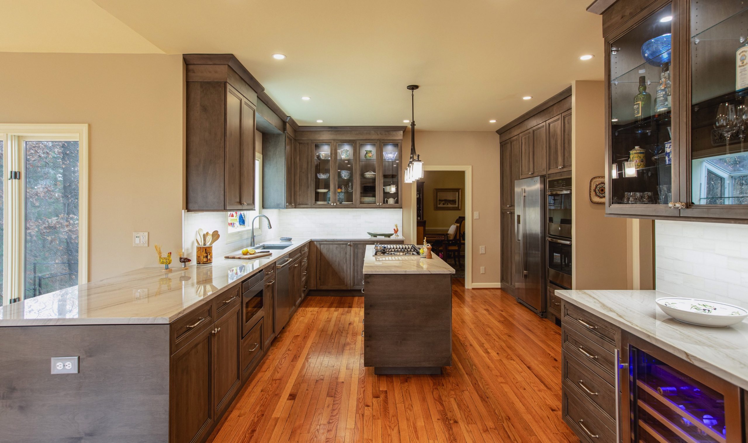 A kitchen with a spacious island and wooden floors