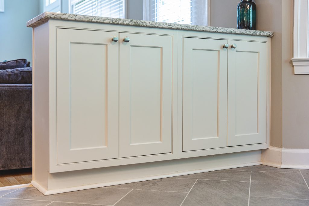 Contemporary kitchen with white cabinets and countertop