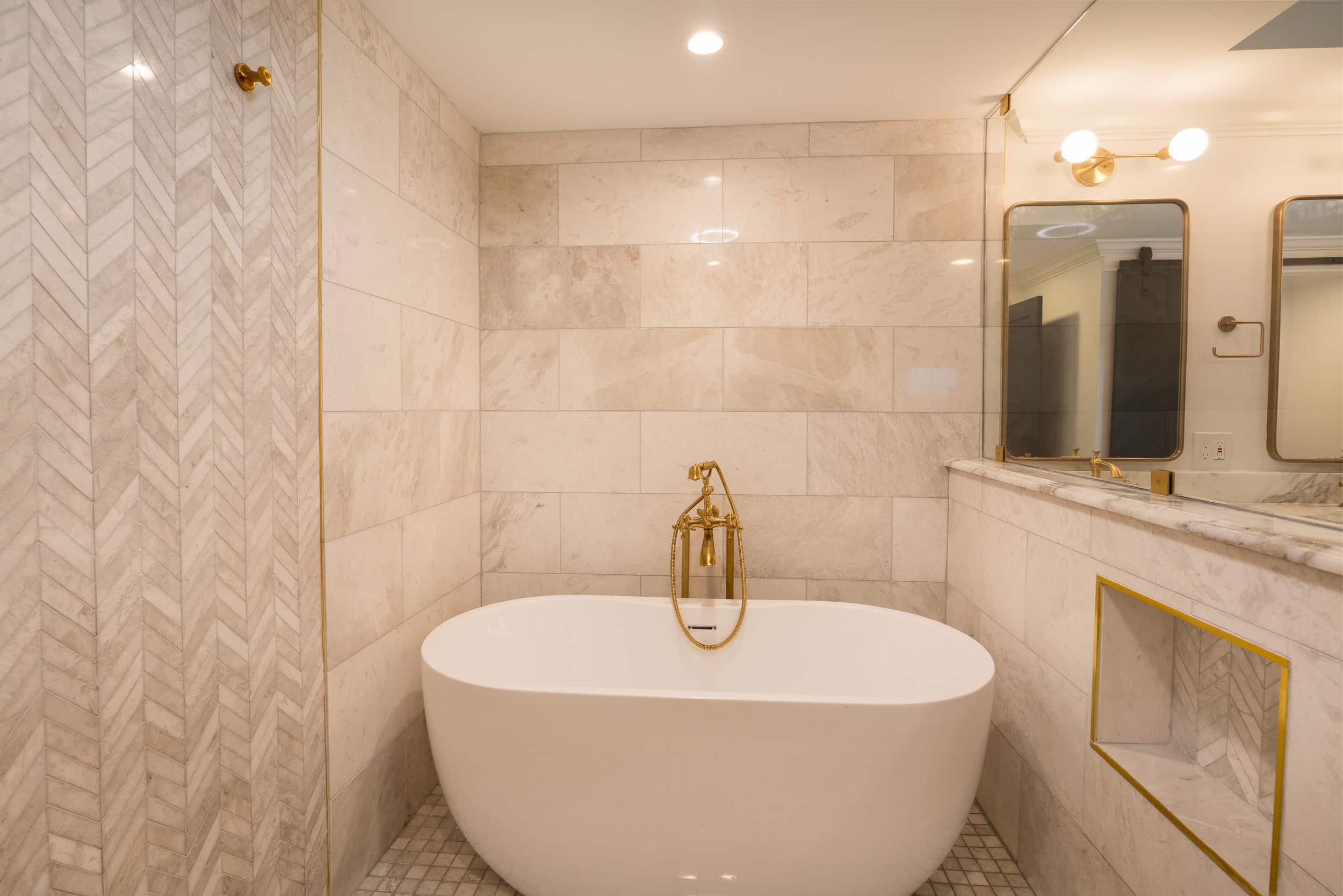 bathroom with white bathtub and mosaic tile wall