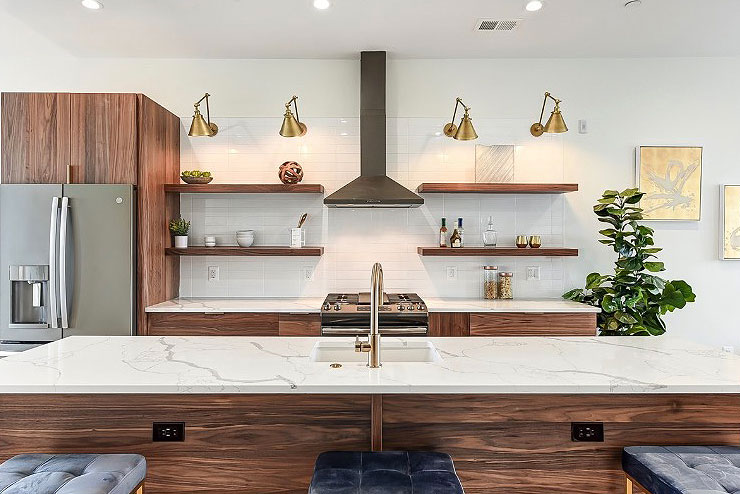kitchen with a marble island and wooden cabinets