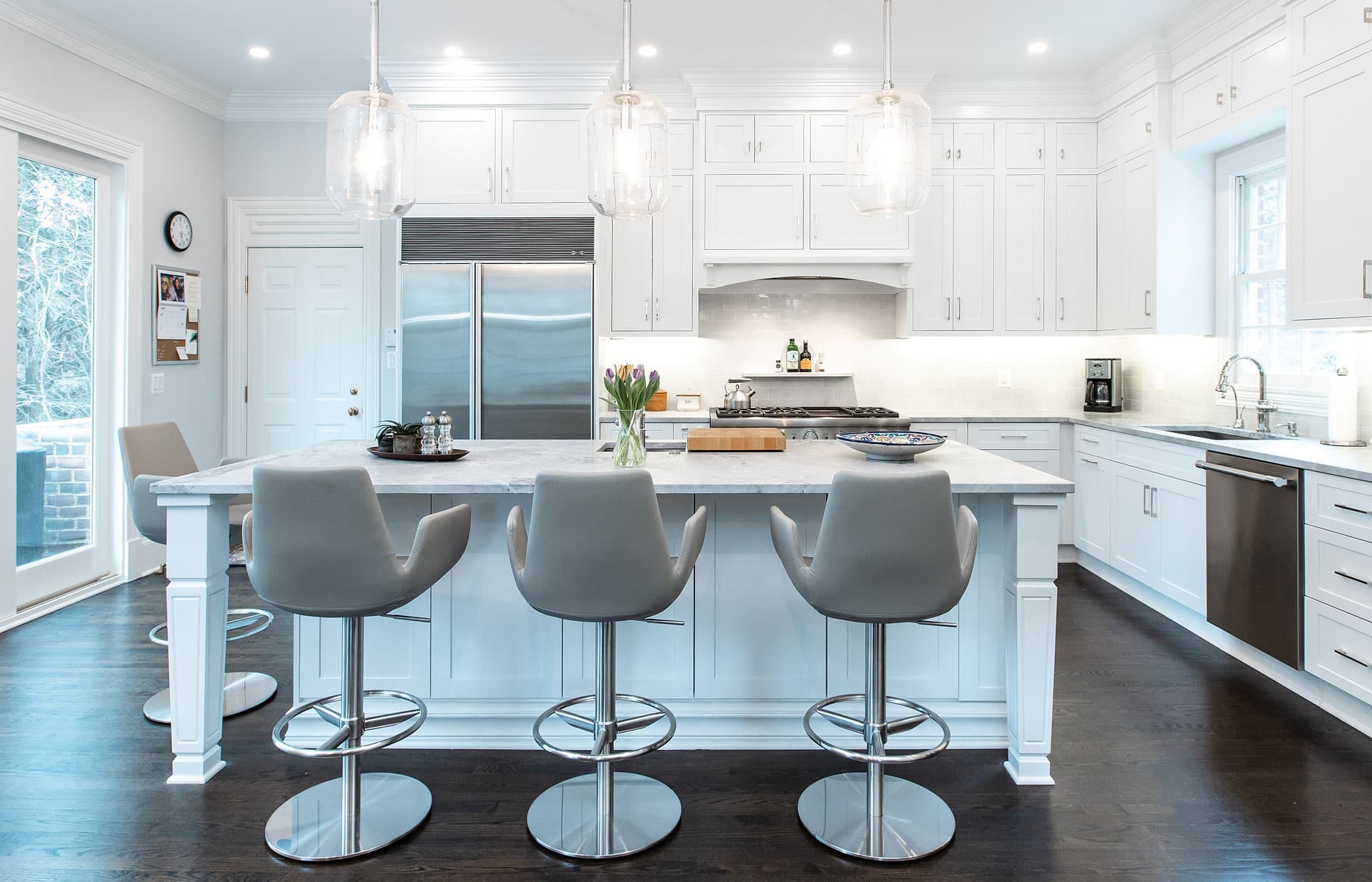 white kitchen cabinets and chair