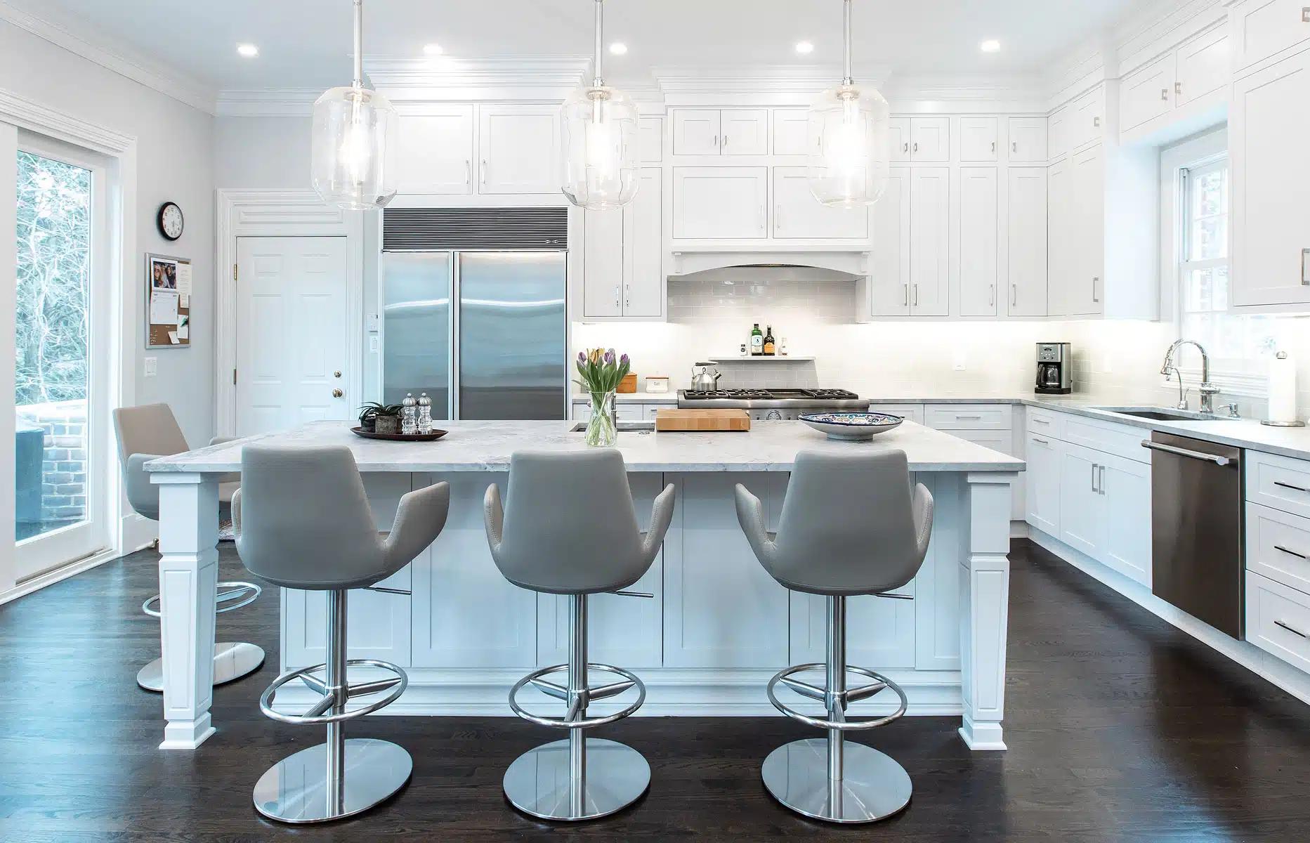white kitchen cabinets and chair