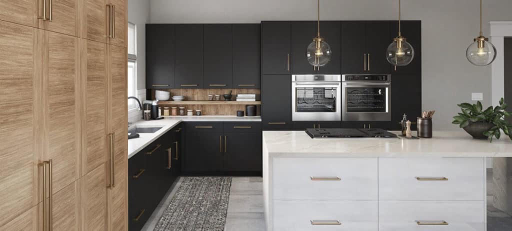 a kitchen with black cabinets and white countertops