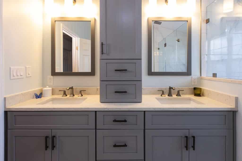 bathroom with two sinks and a mirror