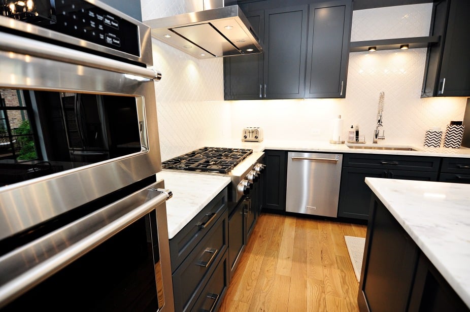 Modern Kitchen with black cabinets and appliances