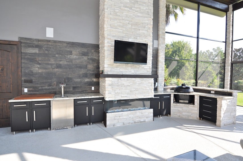 A cozy kitchen with a spacious TV and a warm fireplace