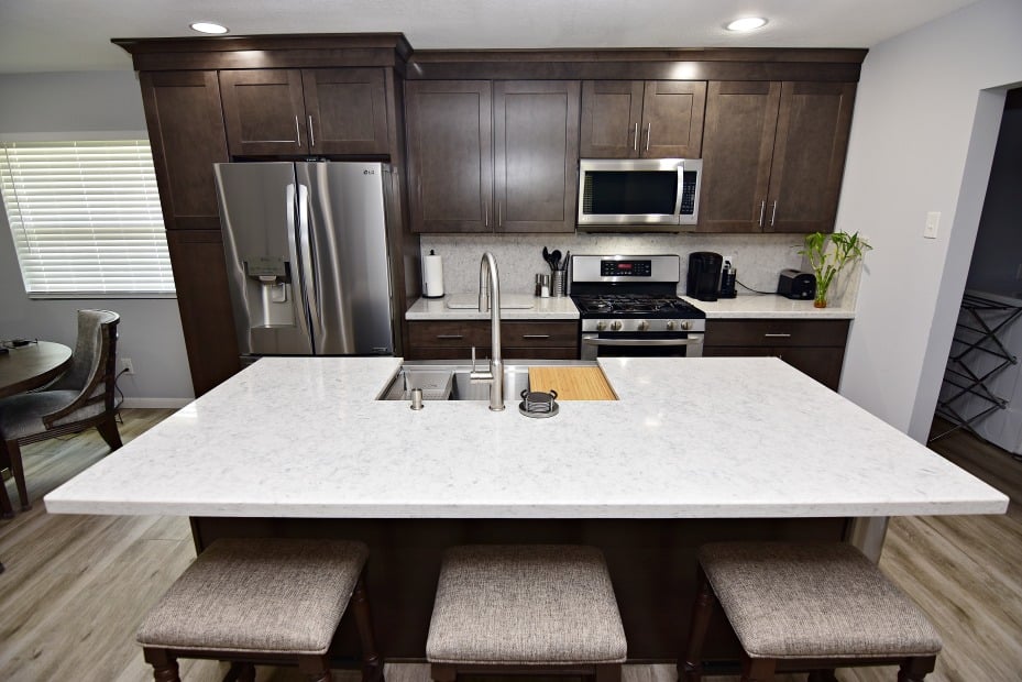 A modern kitchen with sleek stainless steel appliances and elegant granite countertops