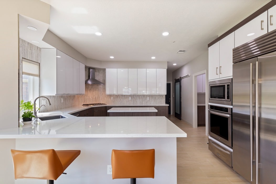 white kitchen cabinets with a large island