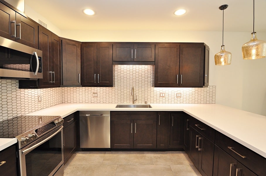 kitchen with dark brown cabinets and white counter tops