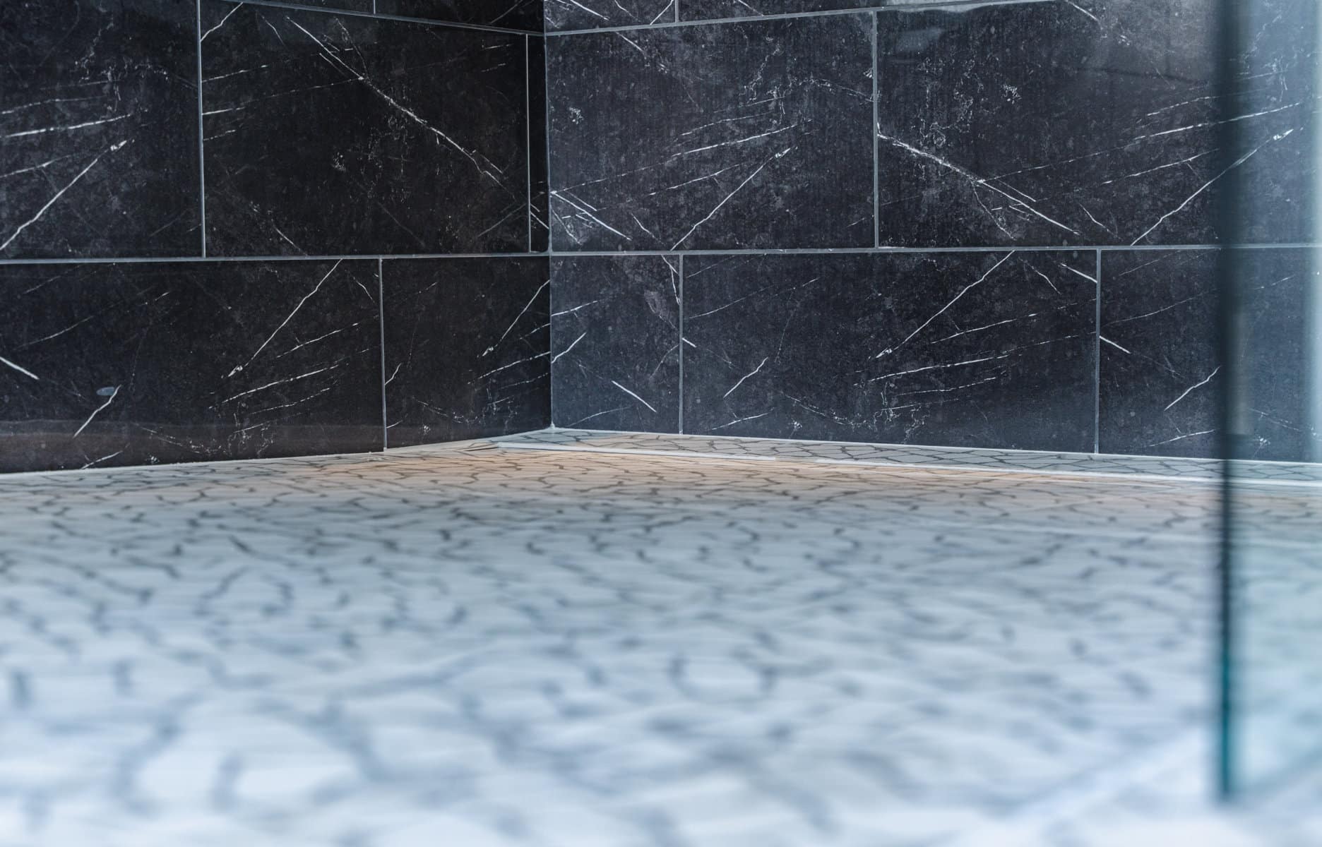 Bathroom with a Marble tile and a black wall