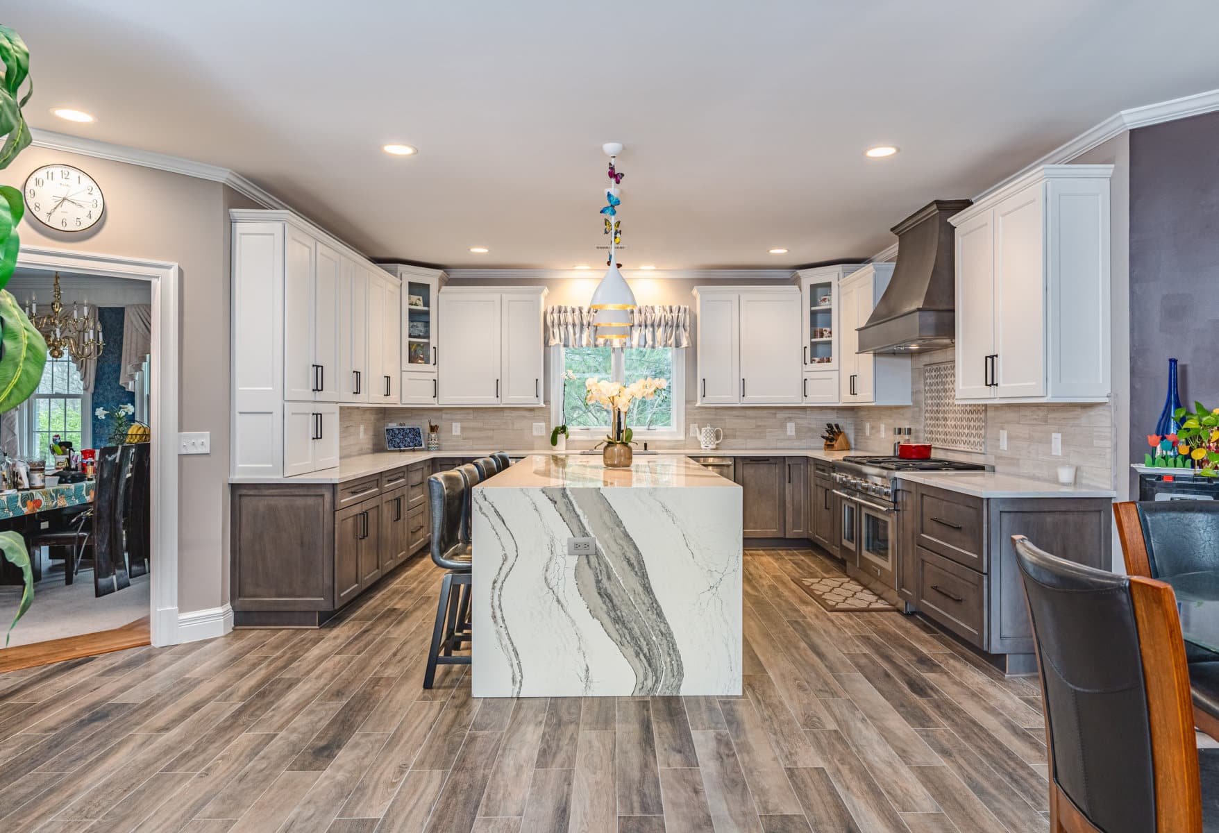 A spacious kitchen featuring a sizable island and a dining table