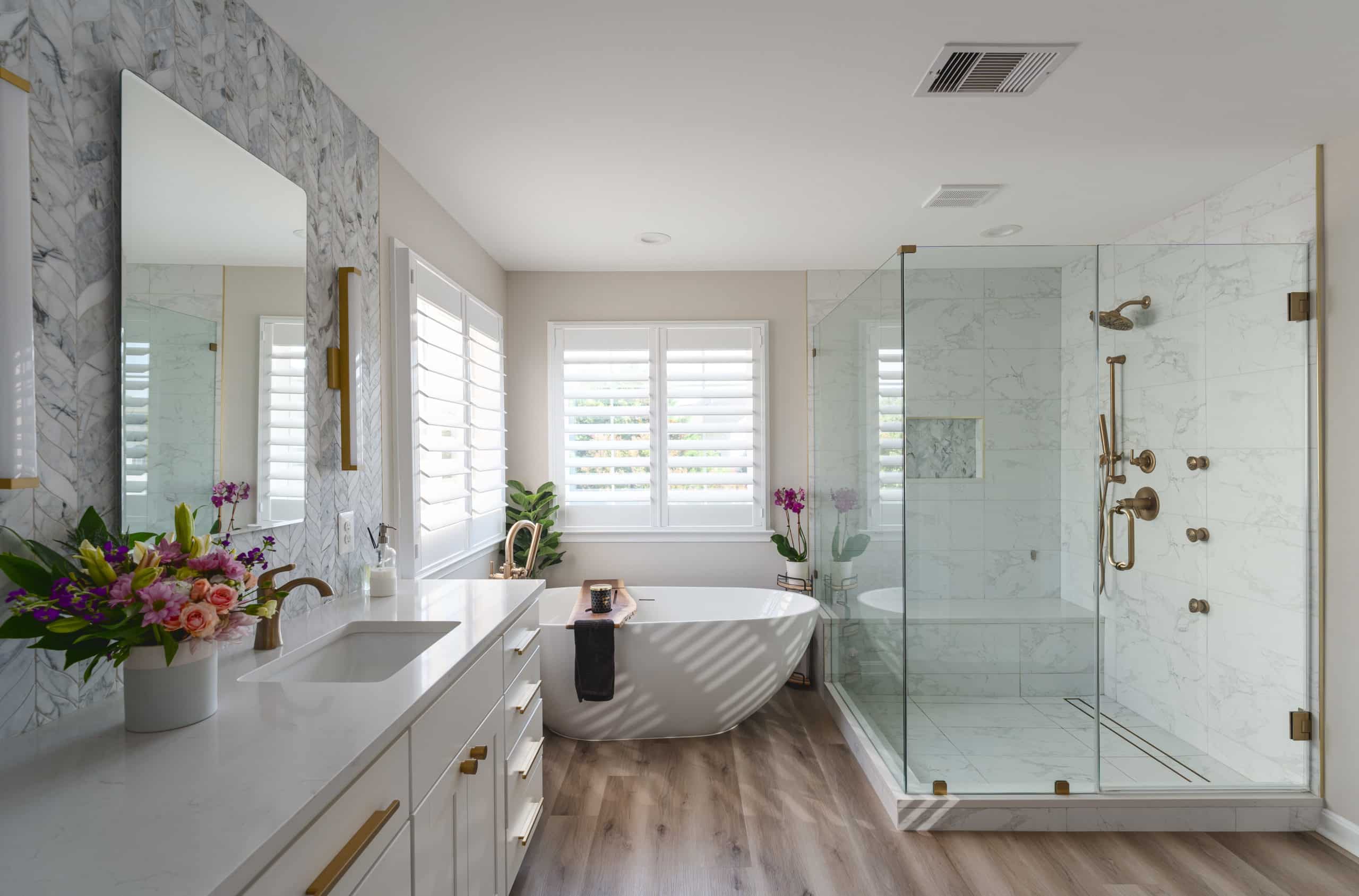 White Bathroom Cabinets with a walk in shower and a tub