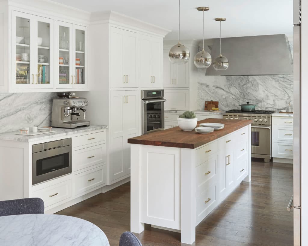 kitchen with white cabinets and marble counter tops