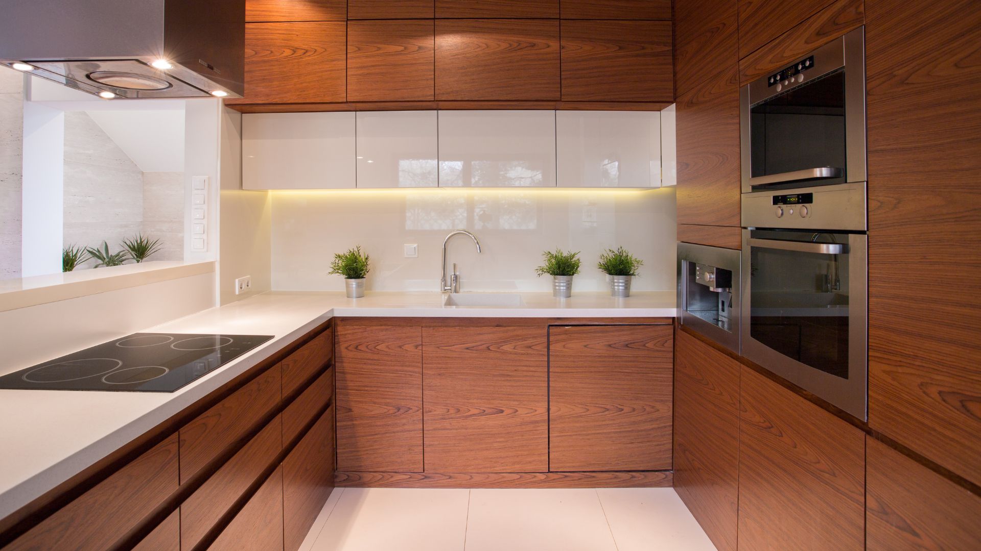 Frameless Brown Kitchen Cabinets with a sink