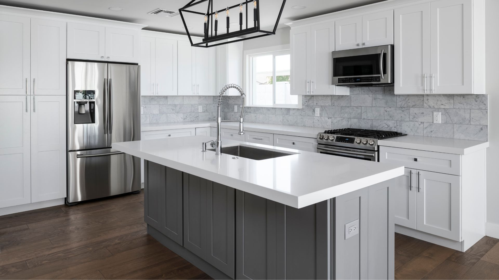 kitchen with white cabinets and a large island