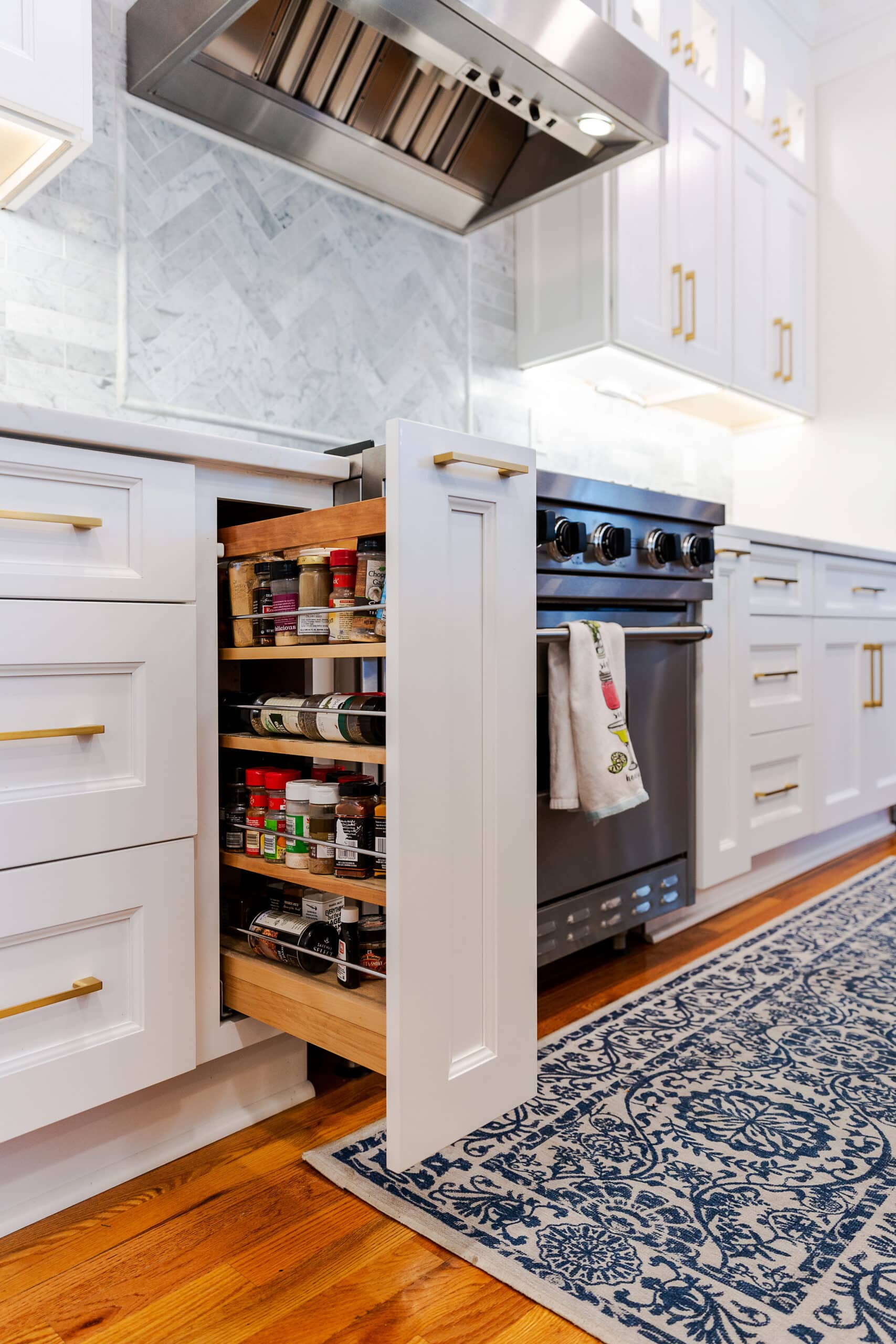 A White kitchen cabinets and condiments rack cabinet
