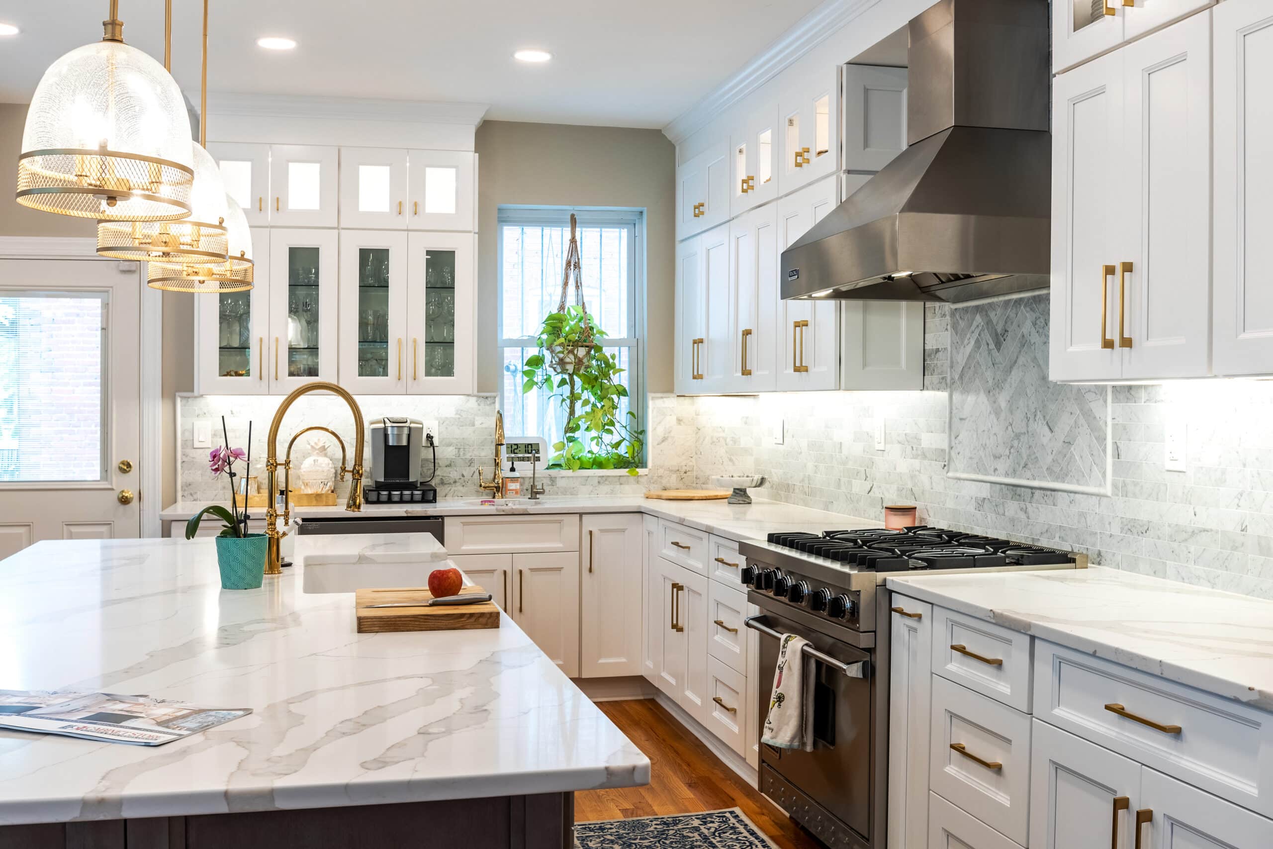 White kitchen cabinets with kitchen island and a sink