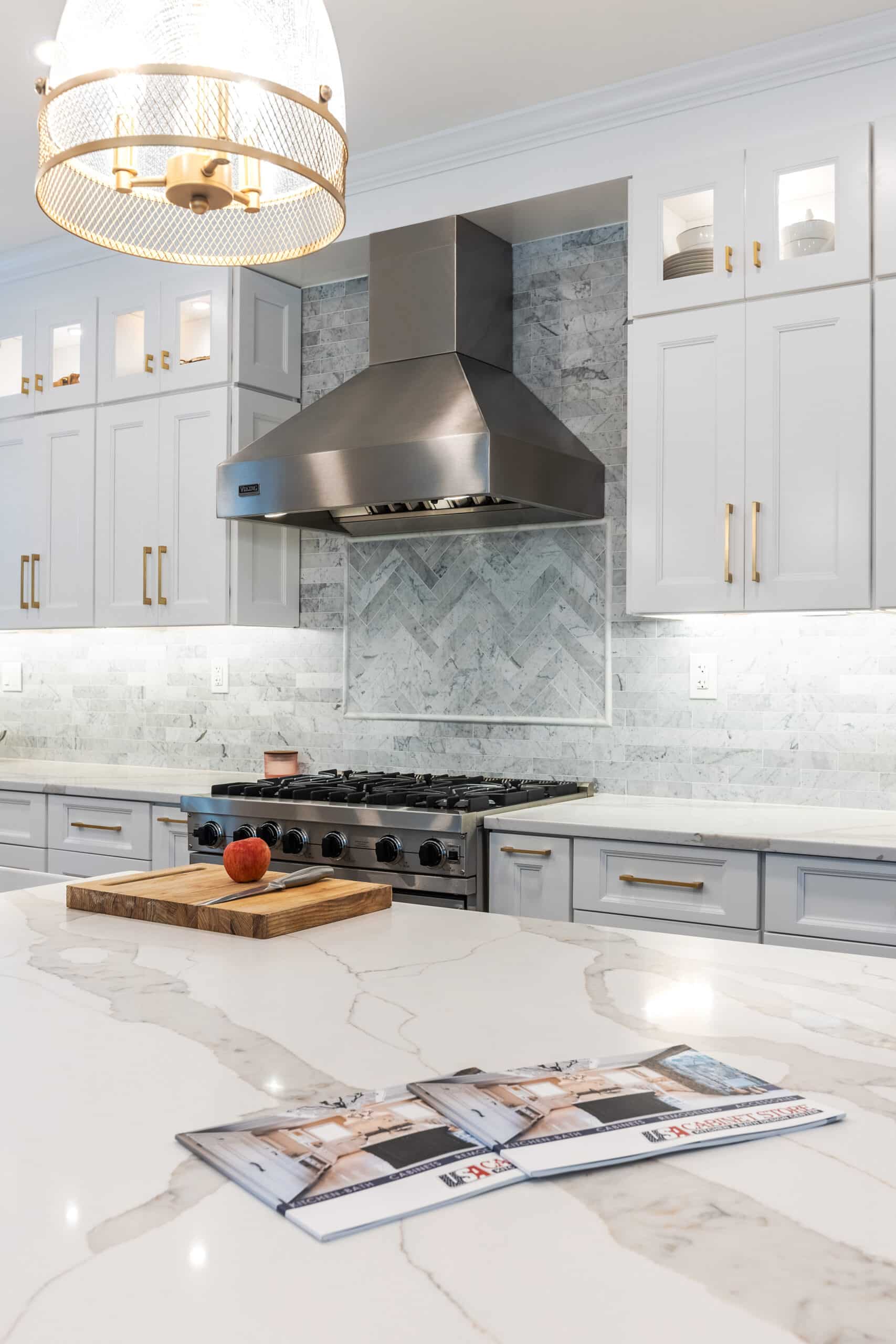 A contemporary kitchen featuring elegant marble countertops and a stylish stove