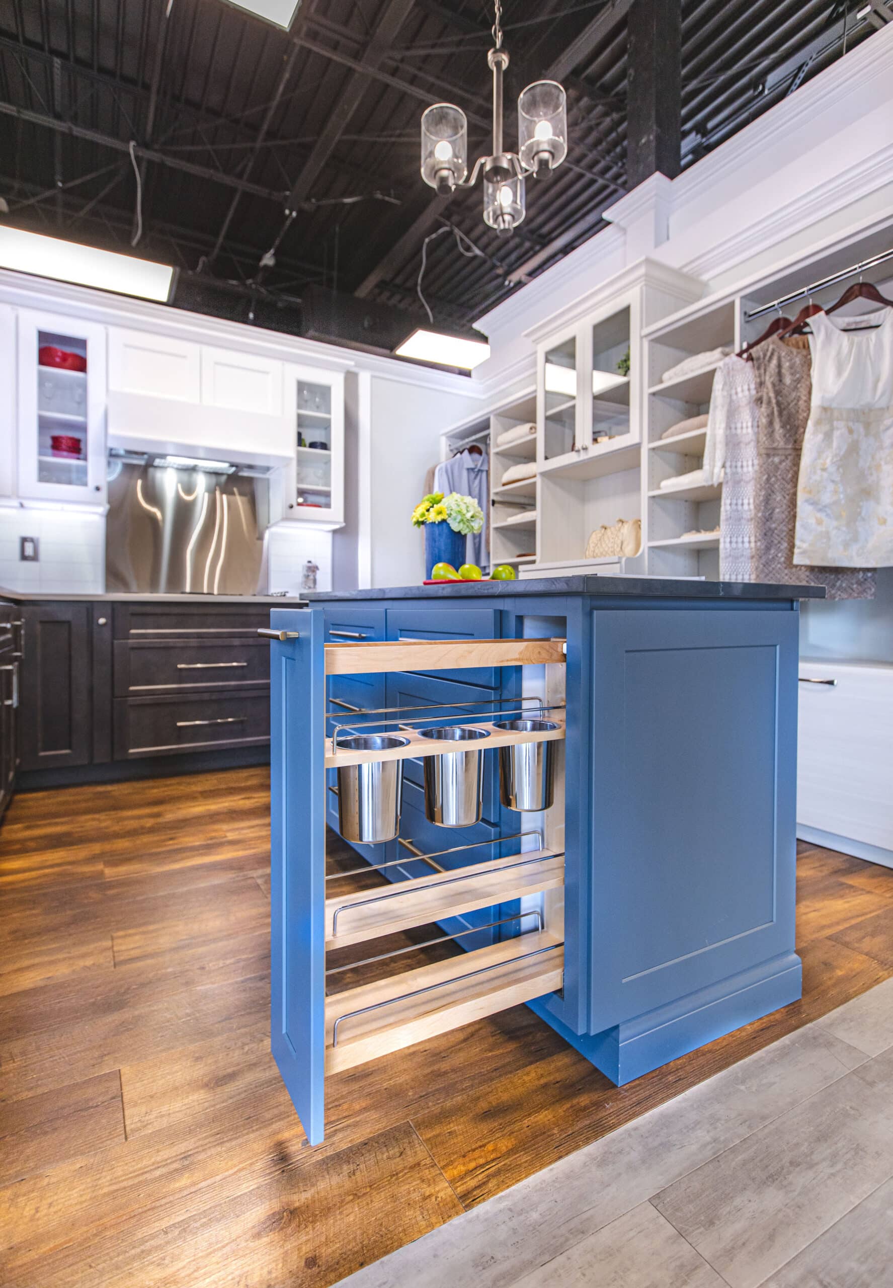 A kitchen with blue cabinets and a white counter top