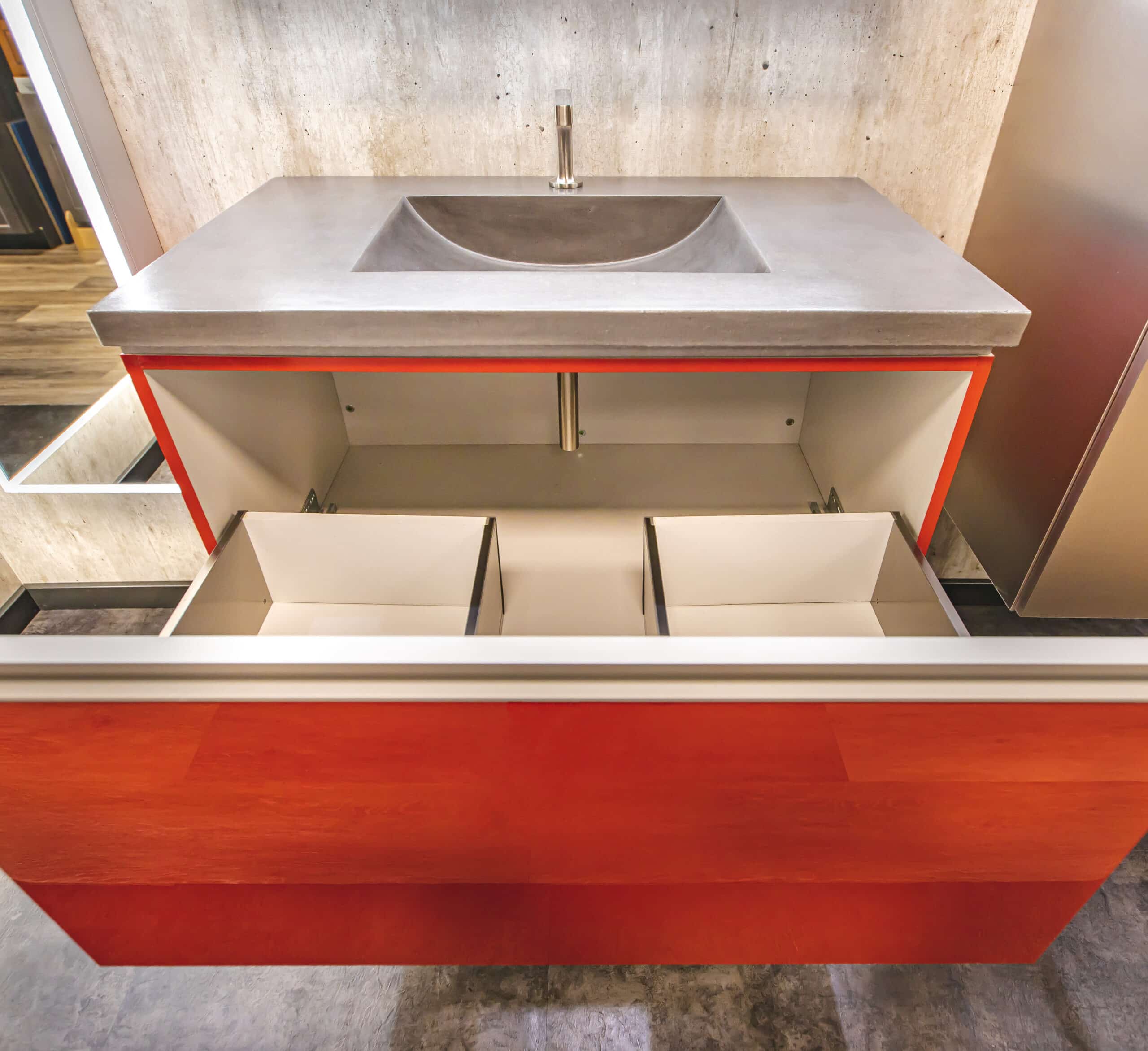 A sink with a drawer underneath it