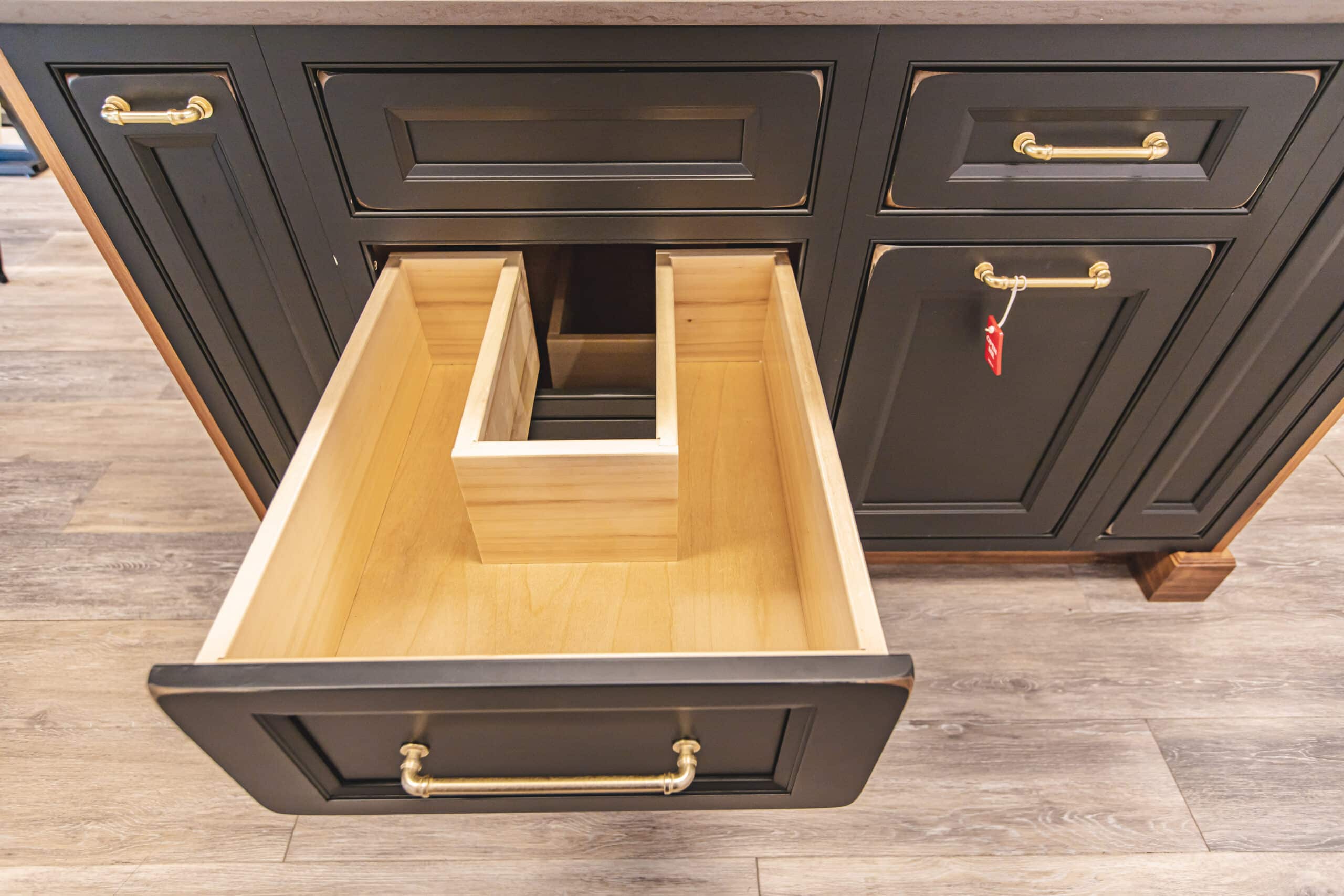 A cabinet drawer with a organized storage space
