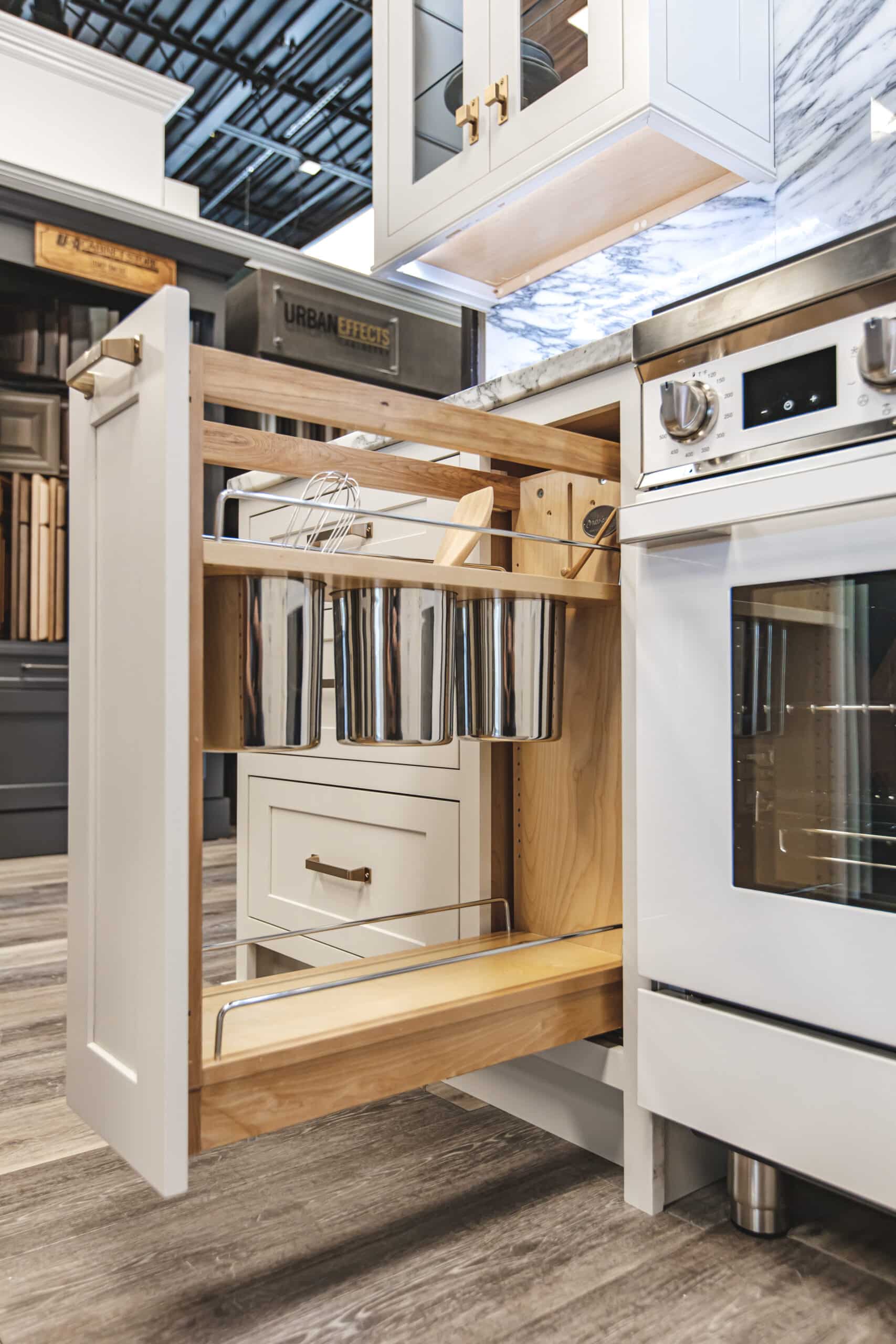 A kitchen with a pull-out drawer and a stove