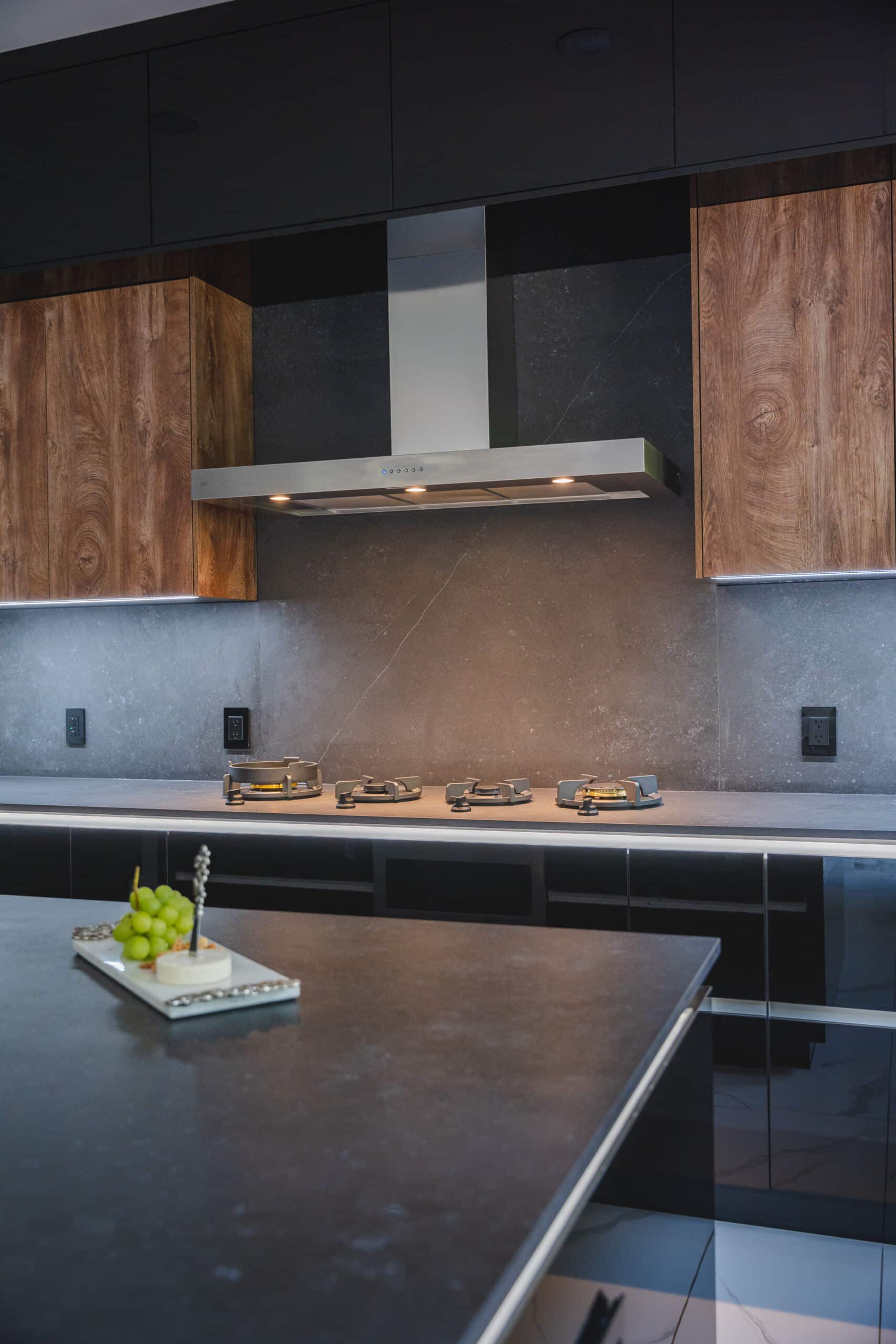 A kitchen with a sleek black countertops