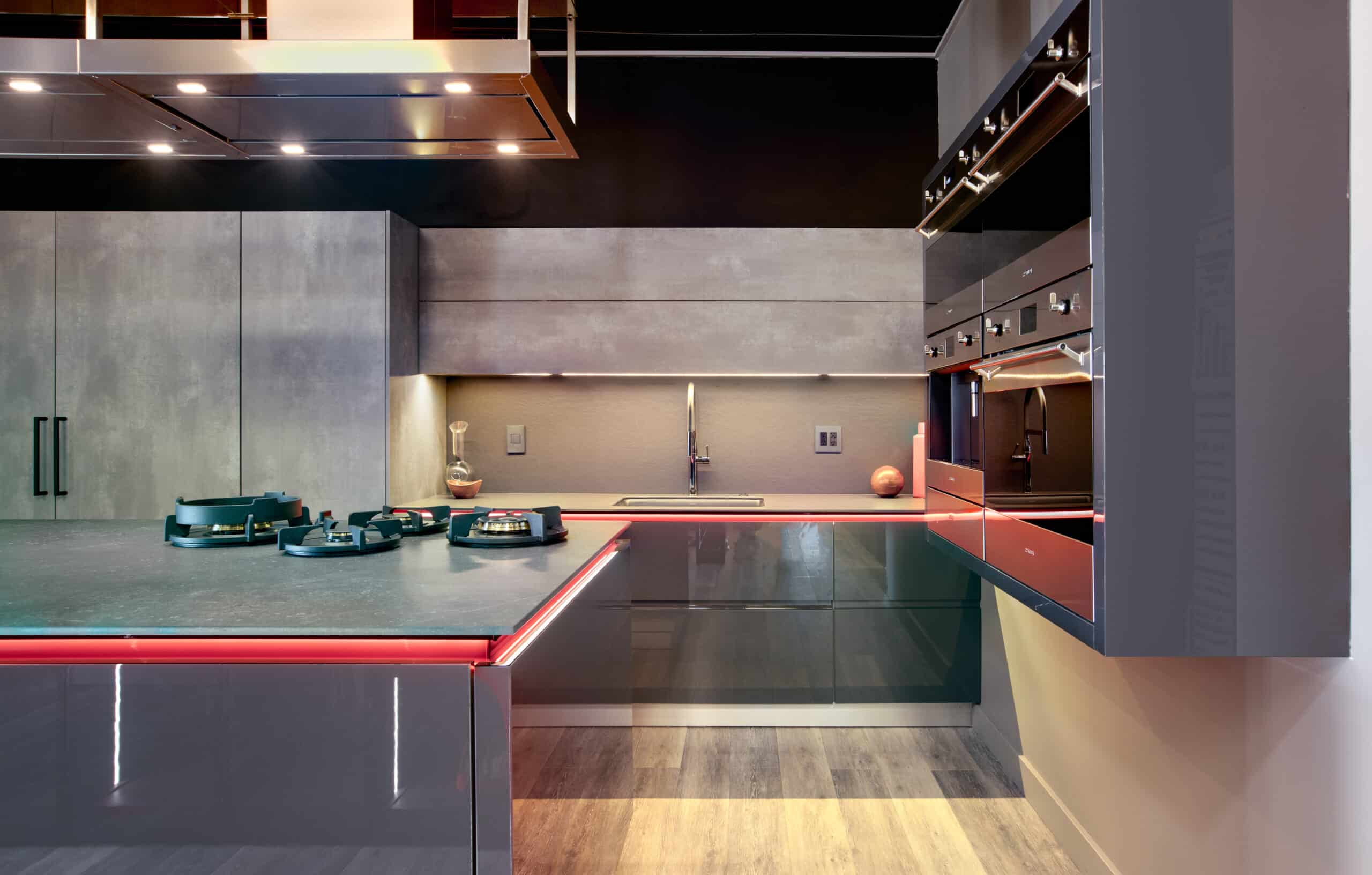 modern kitchen with countertops and a red lightning