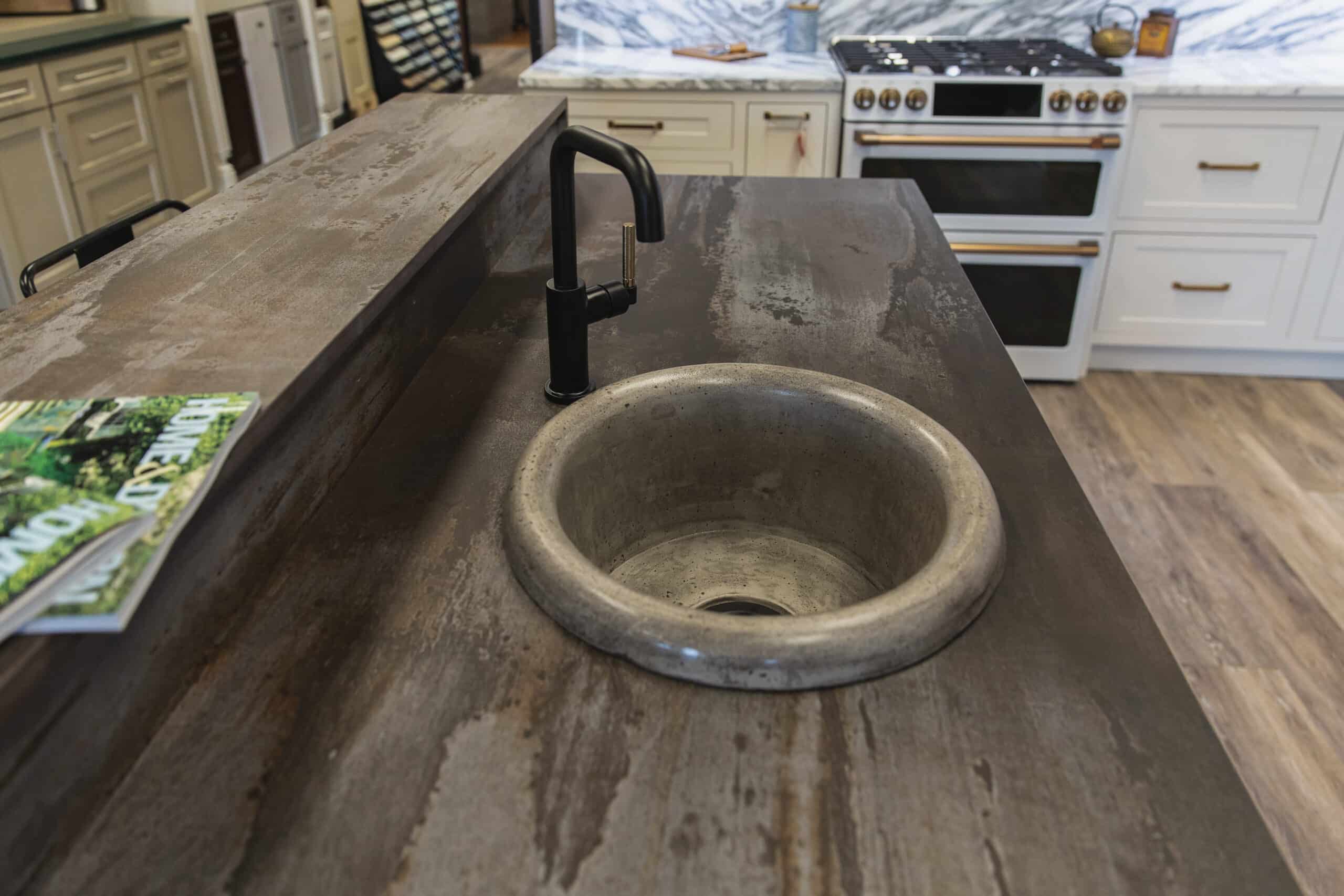 A kitchen counter with a sink and wooden counter