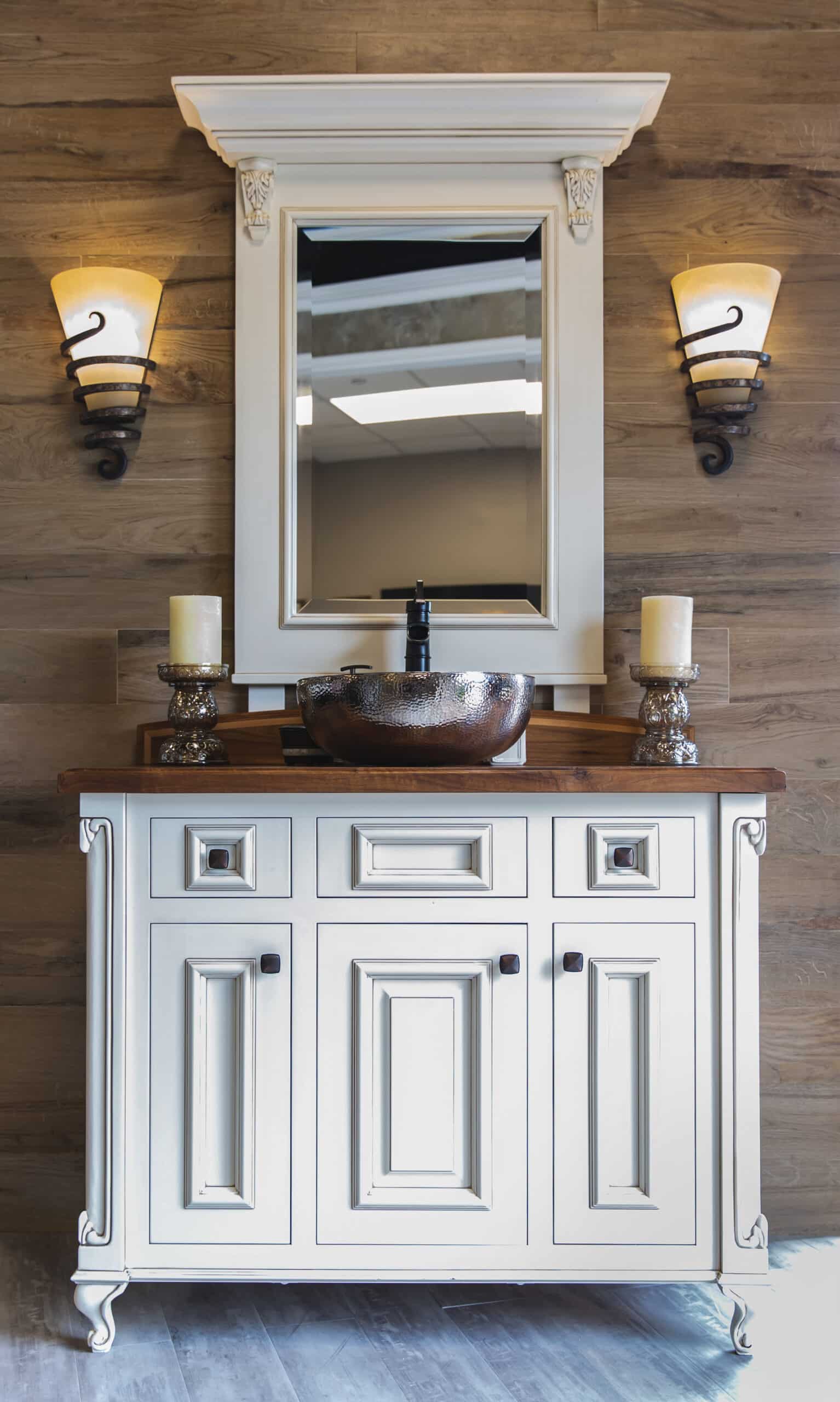 A bathroom vanity with a mirror and two lights