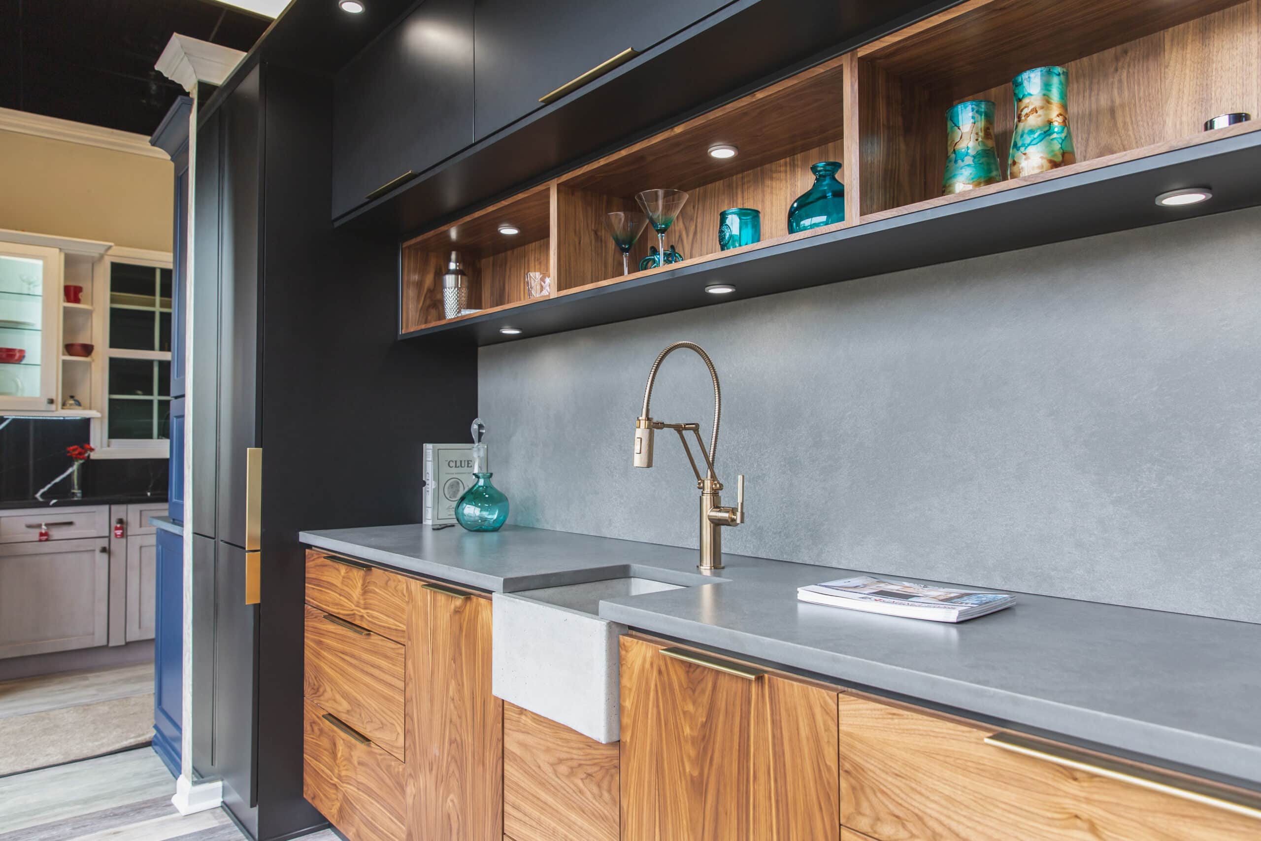 A well-equipped kitchen with a sink, countertop, and cabinets for storage