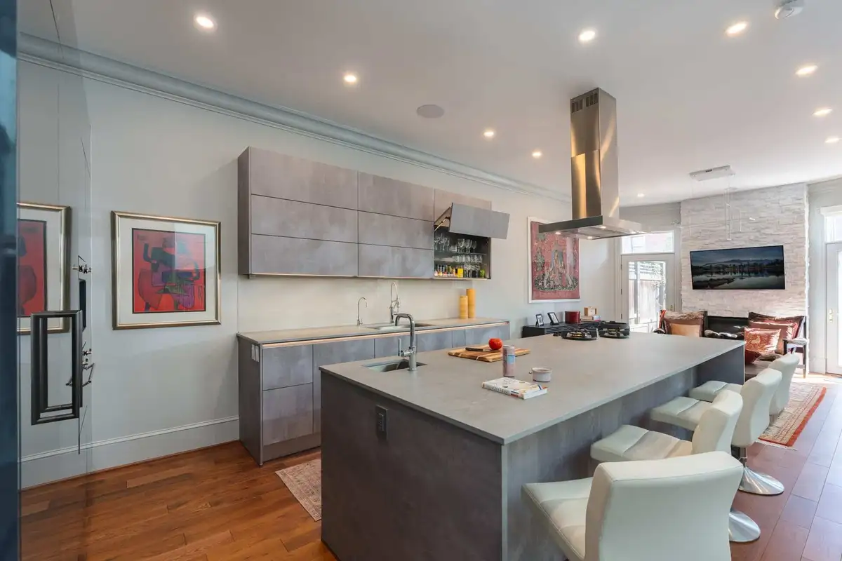 a kitchen designed with horizontal lines to make it look bigger