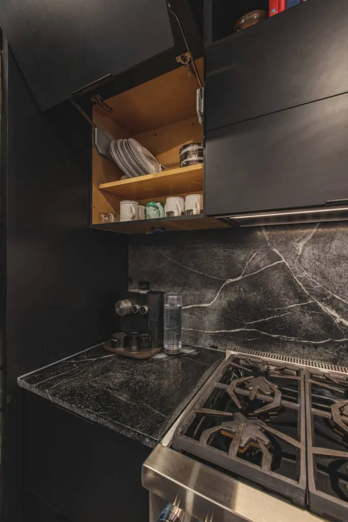 Modern black kitchen with professional range and Showplace EVO cabinets Washington DC