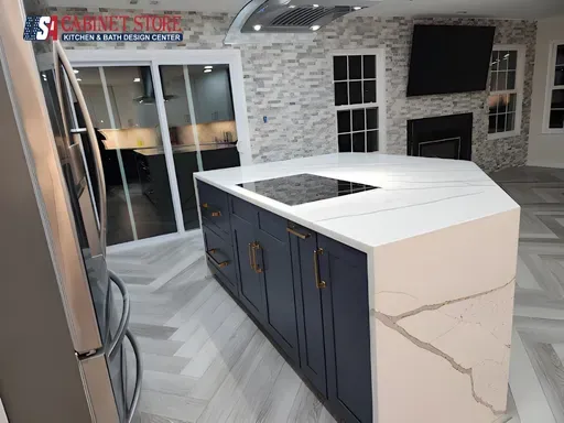 Kitchen Remodeling in Orlando: What to Expect (2026 Homeowner Guide) 13 Open-concept kitchen with stone accent wall and TV