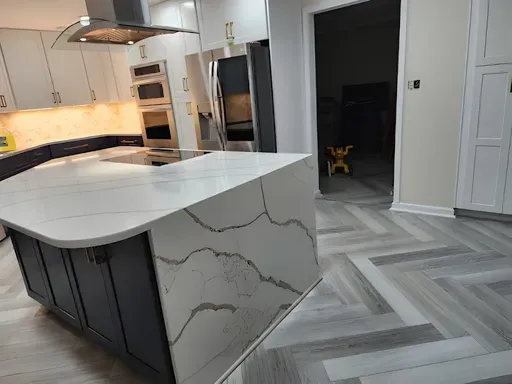 Kitchen Remodeling in Orlando: What to Expect (2026 Homeowner Guide) 12 Quartz waterfall island, herringbone floor, induction cooktop