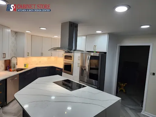 Kitchen Remodeling in Orlando: What to Expect (2026 Homeowner Guide) 11 Two-tone kitchen with calacatta peninsula, recessed lighting