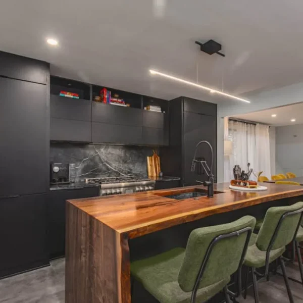 Contemporary dark kitchen with Showplace EVO cabinets and green accent chairs DC