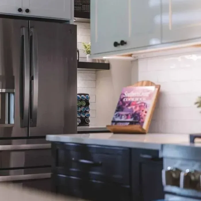 Park Creek Miyuki kitchen coffee station with Keurig, floating shelves, and stainless steel refrigerator
