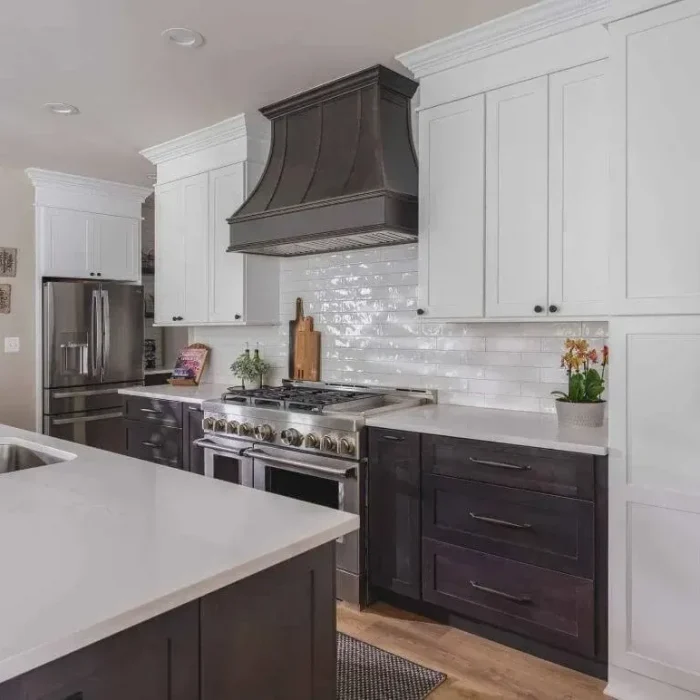 Park Creek Miyuki transitional kitchen with black stainless steel refrigerator and custom dark wood vent hood
