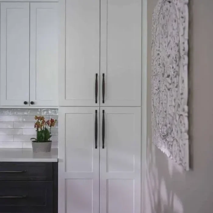 Park Creek Miyuki floor-to-ceiling white shaker pantry cabinets with long black handles