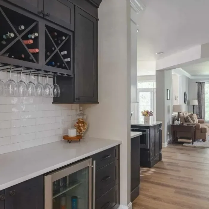 Park Creek Miyuki home bar with black wine storage cabinets and beverage cooler